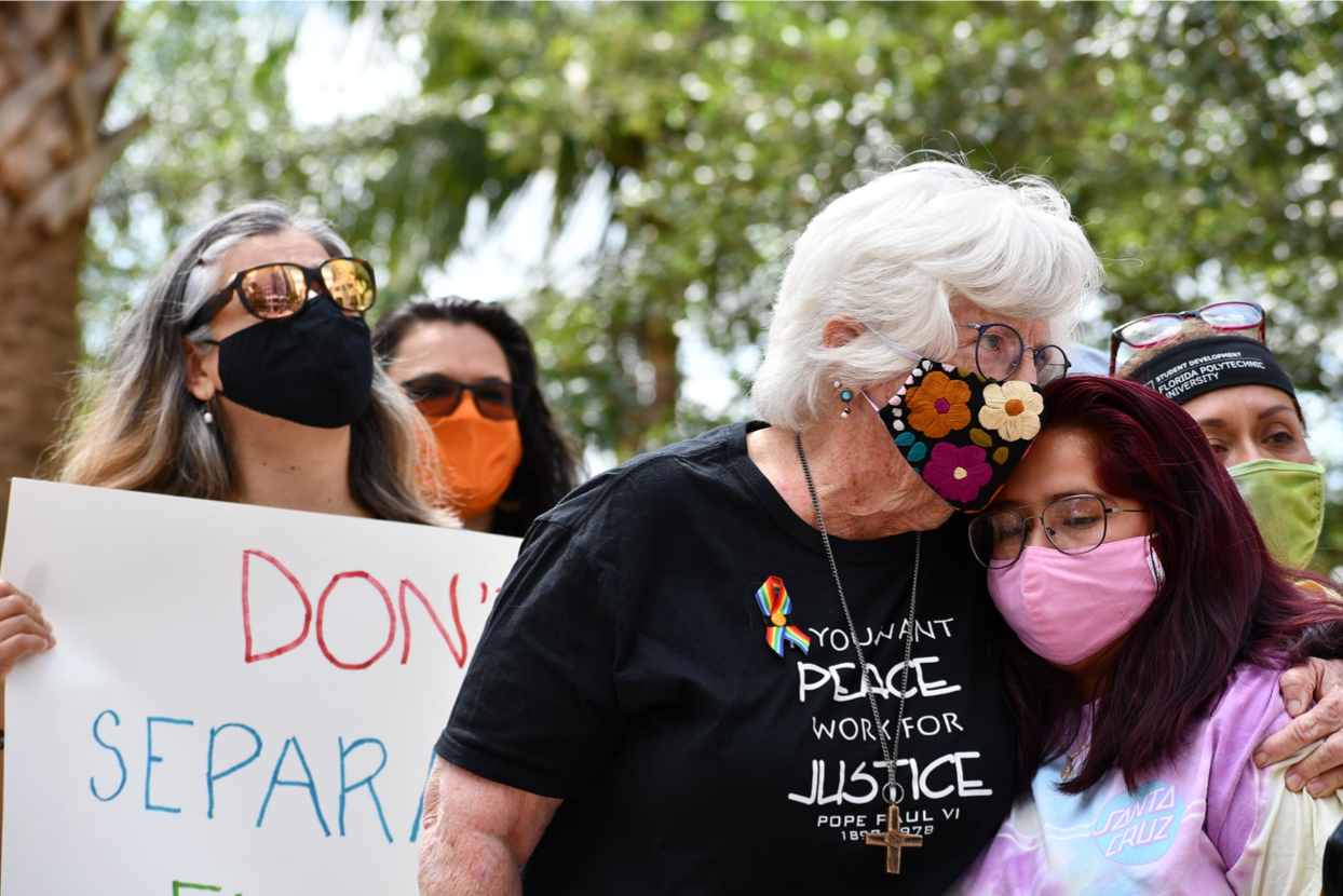 Sister Anne Kendrick of HOPE CommUnity Center in Apopka, Florida, embraces a Latina girl who is a DREAMer.